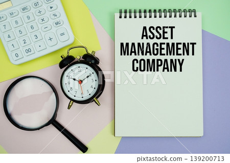 Asset Management Company text with calculator, alarm clock and magnifying glass Asset Management Company text with calculator, alarm clock and magnifying glass 139200713