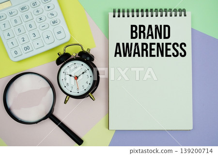 Brand Awareness text with calculator, alarm clock and magnifying glass 139200714