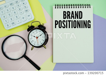 Brand Positioning text with calculator, alarm clock and magnifying glass 139200715