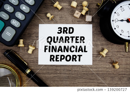 3rd Quarter Financial Report text written on notepad with pen, alarm clock, magnifying glass and calculator on wooden background 3rd Quarter Financial Report text written on notepad with pen, alarm clock, magnifying glass and calculator on wooden background 139200727