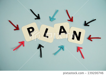 word "PLAN" on cards with colorful arrows pointing toward it, highlighting the concept of planning 139200746