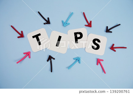 word "TIPS" on cards with colorful arrows pointing toward it, highlighting the concept of instruction 139200761
