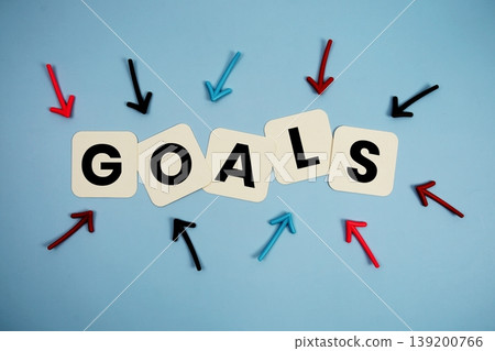 word "GOALS" on cards with colorful arrows pointing toward it, highlighting the concept of planning 139200766