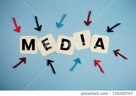 word "MEDIA" on cards with colorful arrows pointing toward it, highlighting the concept of content word "MEDIA" on cards with colorful arrows pointing toward it, highlighting the concept of content 139200767