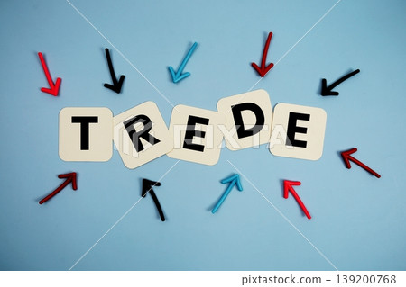 word "TRADE" on cards with colorful arrows pointing toward it, highlighting the concept of business and financial word "TRADE" on cards with colorful arrows pointing toward it, highlighting the concept of business and financial 139200768