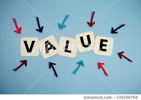 word "VALUE" on cards with colorful arrows pointing toward it, highlighting the concept of quality word "VALUE" on cards with colorful arrows pointing toward it, highlighting the concept of quality 139200769
