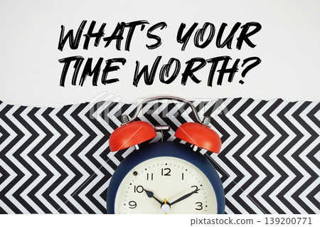 What's Your Time Worth? text written on paper rip with alarm clock flat lay on black chevron background What's Your Time Worth? text written on paper rip with alarm clock flat lay on black chevron background 139200771