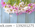 Happy mothers or birthday greeting card template, bouquet of pink and white cosmos flowers on a blue wooden background; copy space 139201275