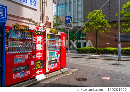A scene with a red vending machine in front of Akihabara Station, Tokyo. A scene with a red vending machine in front of Akihabara Station, Tokyo. 139201622