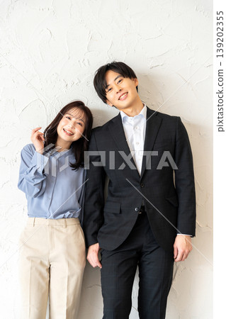 Young men and women cuddling with smiles Young men and women cuddling with smiles 139202355