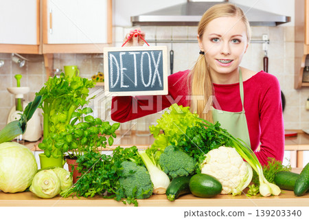 Woman having green diet vegetables, detox sign Woman having green diet vegetables, detox sign 139203340