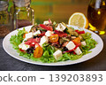 Ready salad in a plate. 139203893