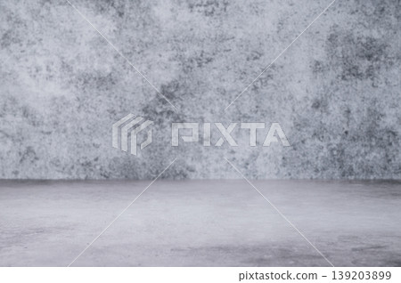 An empty concrete countertop against a gray textured wall. A minimalist style on a gray background. An empty concrete countertop against a gray textured wall. A minimalist style on a gray background. 139203899
