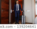 Successful Businessman Arriving Inside Hotel Room With Rolling Suitcase 139204641