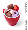 Red coffee cup filled with colorful heart shaped chocolates isolated on white background 139204953