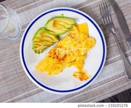 Healthy vegan dish - avocado omelette close up Healthy vegan dish - avocado omelette close up 139205276