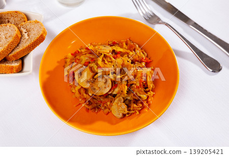 Stewed cabbage with mushrooms served on platter Stewed cabbage with mushrooms served on platter 139205421