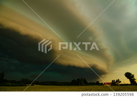 Storm clouds of thunderstorm over a field in Lithuania Storm clouds of thunderstorm over a field in Lithuania 139205598