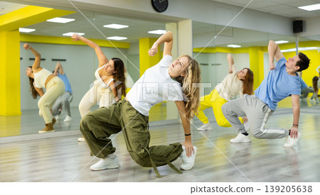 Group portrait of lucky teenagers in dance studio Group portrait of lucky teenagers in dance studio 139205638