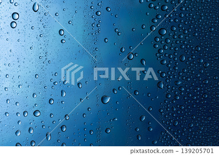 Water droplets attached to the glass Water droplets attached to the glass 139205701