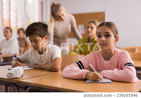Boy and girl studying in classroom 139205846
