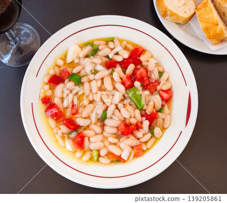 Traditional Catalan cold salad with white beans, cod and vegetables Traditional Catalan cold salad with white beans, cod and vegetables 139205861