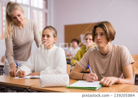 Group of school kids and teacher during lesson 139205864