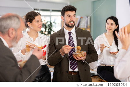 People eat Chinese noodles for lunch People eat Chinese noodles for lunch 139205984