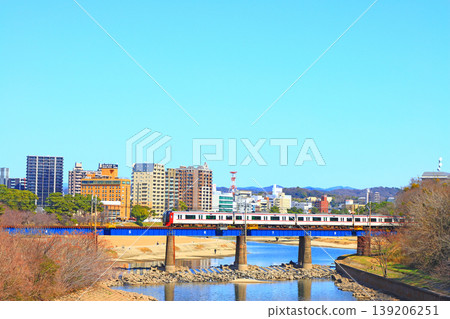 Okazaki City, Aichi Prefecture, scenery of the townscape of Okazaki City and Meitetsu train Okazaki City, Aichi Prefecture, scenery of the townscape of Okazaki City and Meitetsu train 139206251