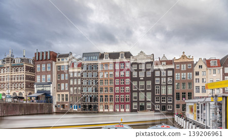 Hyperlapse of colorful Canal Houses on Damrak in evening light. Amsterdam, Netherlands Hyperlapse of colorful Canal Houses on Damrak in evening light. Amsterdam, Netherlands 139206961