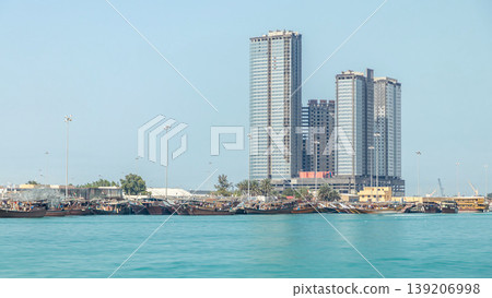 Traditional wooden fishing dhows berthed in the Dhow Harbour in Abu Dhabi timelapse Traditional wooden fishing dhows berthed in the Dhow Harbour in Abu Dhabi timelapse 139206998