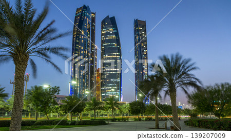 Skyscrapers of Abu Dhabi with Etihad Towers buildings day to night timelapse. Skyscrapers of Abu Dhabi with Etihad Towers buildings day to night timelapse. 139207009