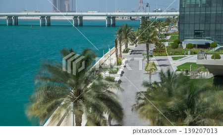 Walkway in Abu Dhabi timelapse with palms 139207013