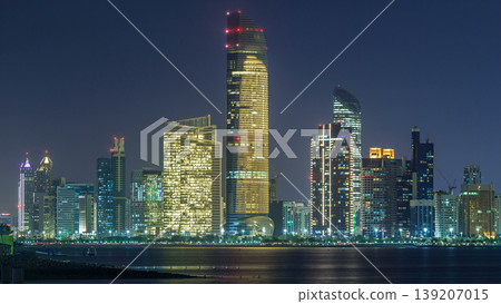 Panorama view of Abu Dhabi Skyline and seafront at night timelapse, United Arab Emirates Panorama view of Abu Dhabi Skyline and seafront at night timelapse, United Arab Emirates 139207015