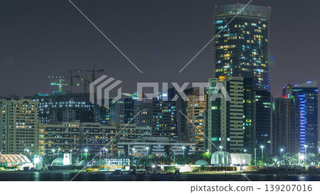 Panorama view of Abu Dhabi Skyline and seafront at night timelapse, United Arab Emirates Panorama view of Abu Dhabi Skyline and seafront at night timelapse, United Arab Emirates 139207016