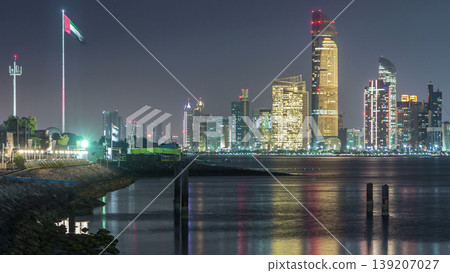 Panorama view of Abu Dhabi Skyline and seafront at night timelapse, United Arab Emirates Panorama view of Abu Dhabi Skyline and seafront at night timelapse, United Arab Emirates 139207027