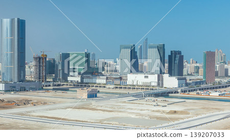 Buildings on Al Reem island in Abu Dhabi timelapse from above. Buildings on Al Reem island in Abu Dhabi timelapse from above. 139207033