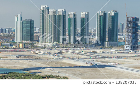 Buildings on Al Reem island in Abu Dhabi timelapse from above. Buildings on Al Reem island in Abu Dhabi timelapse from above. 139207035