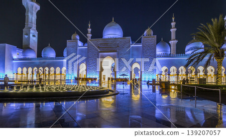 Sheikh Zayed Grand Mosque illuminated at night timelapse hyperlapse, Abu Dhabi, UAE. Sheikh Zayed Grand Mosque illuminated at night timelapse hyperlapse, Abu Dhabi, UAE. 139207057
