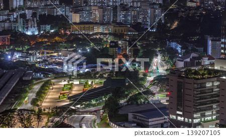Aerial view to busy bus terminal in Singapore night timelapse. 139207105