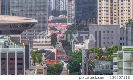 Traffic with cars on a street and urban scene in the central district of Singapore aerial timelapse Traffic with cars on a street and urban scene in the central district of Singapore aerial timelapse 139207118