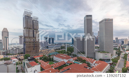 Evening panorama with Marina Bay area and skyscrapers city skyline aerial timelapse. Evening panorama with Marina Bay area and skyscrapers city skyline aerial timelapse. 139207132