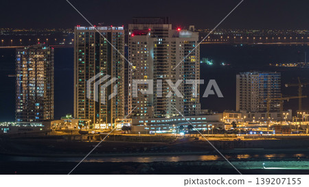 Aerial skyline of Abu Dhabi city centre from above night timelapse Aerial skyline of Abu Dhabi city centre from above night timelapse 139207155