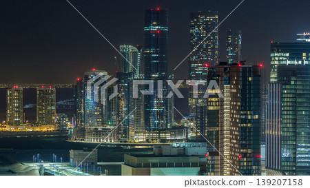 Aerial skyline of Abu Dhabi city centre from above night timelapse Aerial skyline of Abu Dhabi city centre from above night timelapse 139207158