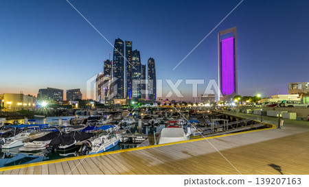 Al Bateen marina Abu Dhabi day to night timelapse with modern skyscrapers on background 139207163
