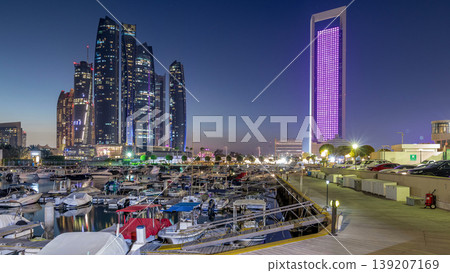 Al Bateen marina Abu Dhabi day to night timelapse with modern skyscrapers on background 139207169