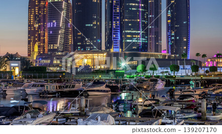 Al Bateen marina Abu Dhabi day to night timelapse with modern skyscrapers on background Al Bateen marina Abu Dhabi day to night timelapse with modern skyscrapers on background 139207170