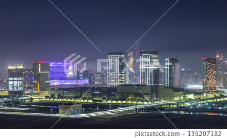 Buildings on Al Reem island in Abu Dhabi night timelapse from above. Buildings on Al Reem island in Abu Dhabi night timelapse from above. 139207182