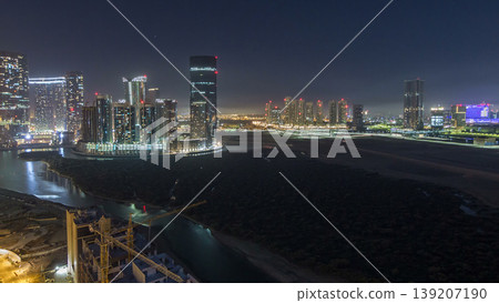 Buildings on Al Reem island in Abu Dhabi night timelapse from above. Buildings on Al Reem island in Abu Dhabi night timelapse from above. 139207190