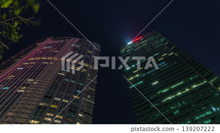 Looking up perspective of modern business skyscrapers glass and sky view landscape of commercial building in central city timelapse 139207222